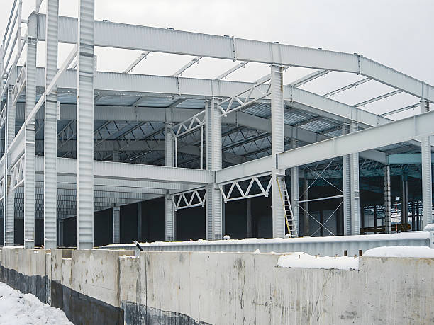 istock Steel structure of a building under construction on a winter day. 2242029956