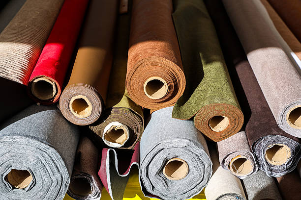 istock Rolls of diverse fabric showing textile variety 2242031003