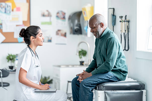 istock Compassionate Doctor Talk With Elder Black Male Patient In Clinic Setting 2242033744
