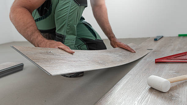 istock Floating floor work. The worker inserts the board of vinyl plank to the click system of Floating floor. 2242039331