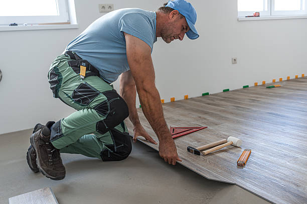 istock Floating floor work. The worker inserts the board of vinyl plank to the click system of Floating floor. 2242039637