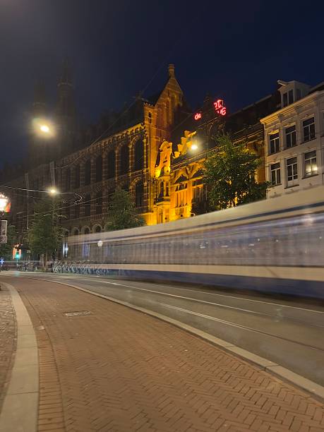 istock Amsterdam night view of a long-exposure tram 2242047154