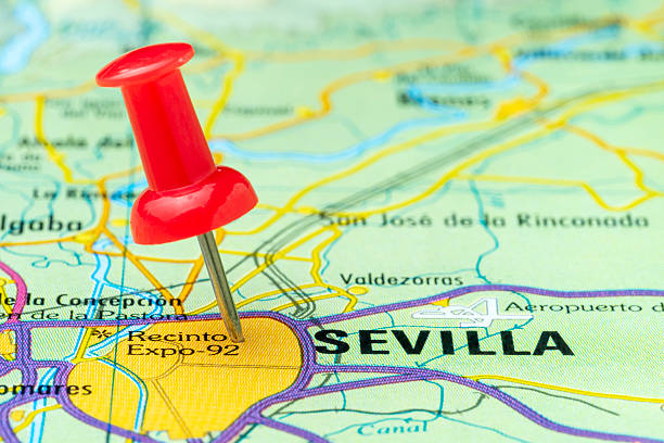 istock Red thumbtack marking Seville city on map 2242049914