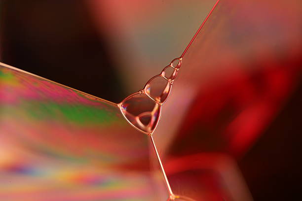 istock Green liquid bubbles background, reflections of liquid in macro 2242051921