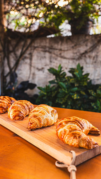 istock Rustic Croissant Selection on Wooden Board 2242052374