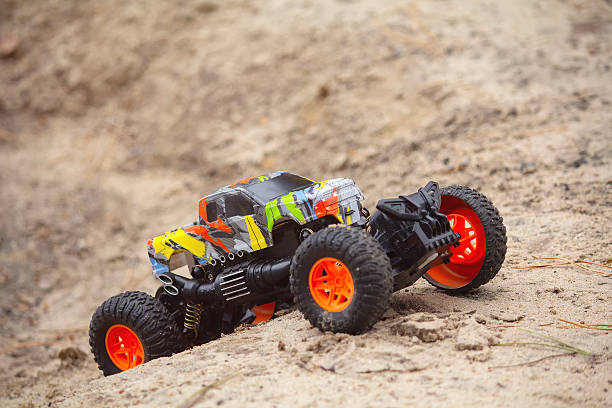 istock Realistic RC off-road toy car climbing sand 2242055678