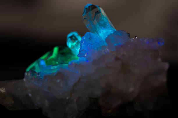 istock Natural quartz crystals in blue prism light 2242058548