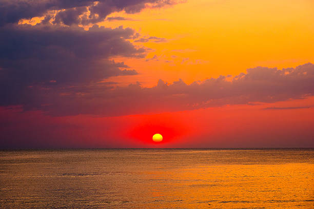 istock dramatic sky at sunrise at the sea 2242059006