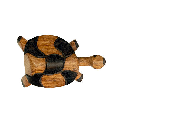 istock Isolated wooden tortoise toy featuring a patterned shell, perfect for children or decorative use 2242061007
