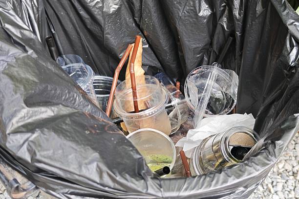 istock A pile of discarded plastic waste in a black trash bag, symbolizing environmental issues. 2242062186