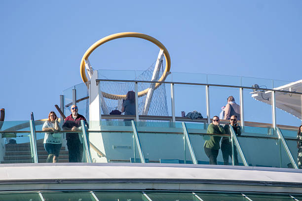 6th October, 2025 - Cruise ship passengers looking out and relaxing on their cruise ship upper deck as they depart from a cruise port stop over in Getxo in Northern Spain