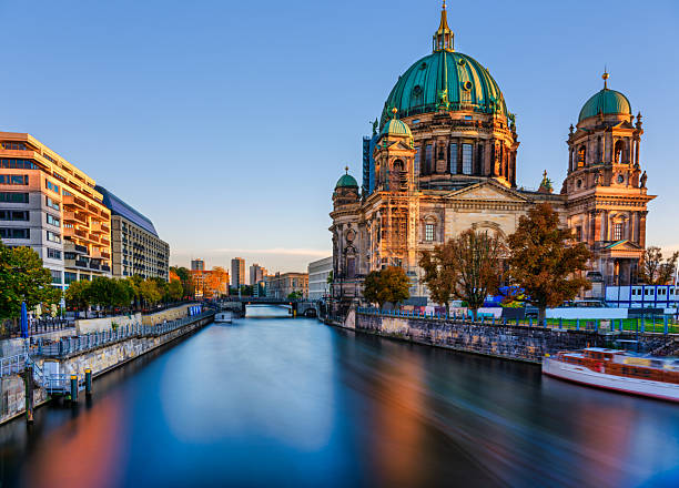 istock Long exposure of sunlit Berlin Cathedral on Spree River at sunset, Berlin, Germany 2242065111
