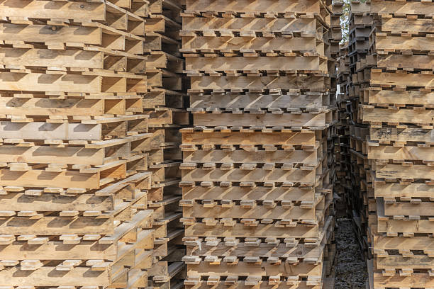 columns of wooden pallets stacked together