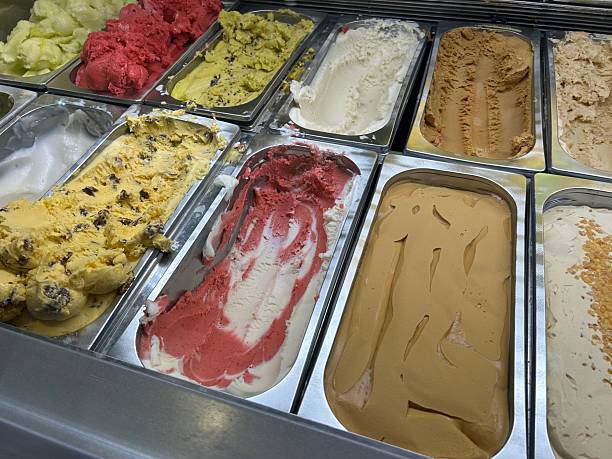 istock Assorted Ice Cream Gelato Flavors Display Case With Vanilla, Chocolate, Strawberry, and Pistachiouni 2242070667