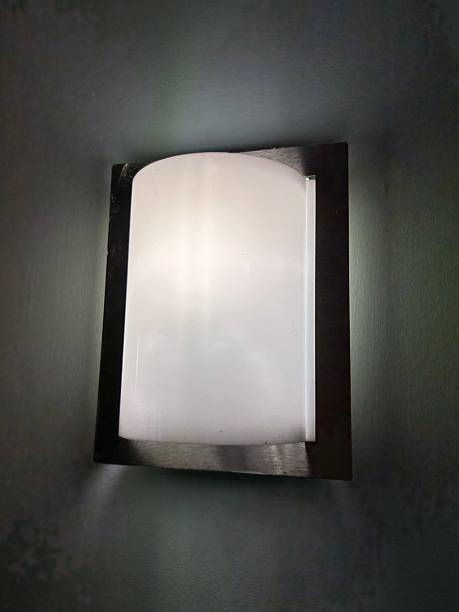 istock Modern Frosted Glass Wall Light With Metal Frame Illuminates Dark Wall for Cozy Interior Lighting 2242070676