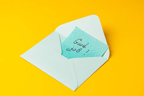 istock Note of encouragement in a bright envelope on yellow background 2242072659