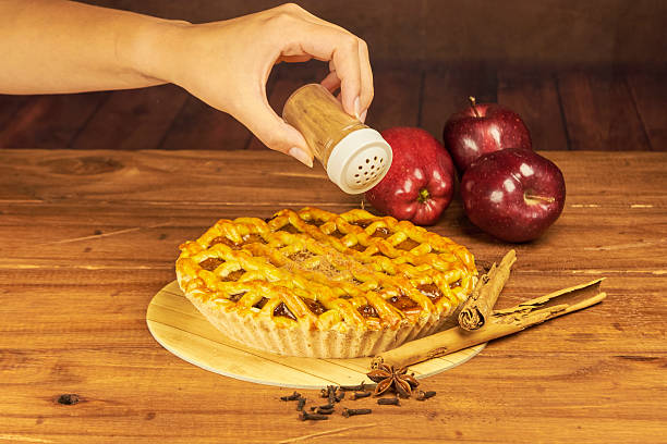 istock Apple pie in close-up on a rustic wooden background. 2242080543