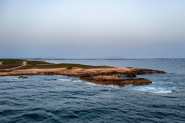 istock Capo Mannu drone aerial view rocky coast eroding into the Mediterranean Sea at sunset in Sardinia, Italy 2242081719