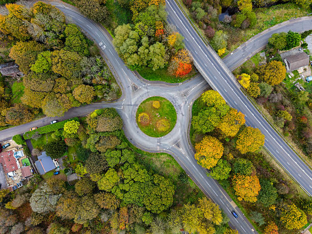 istock Top Down View of Traffic Circle and Autumn Trees 2242083339