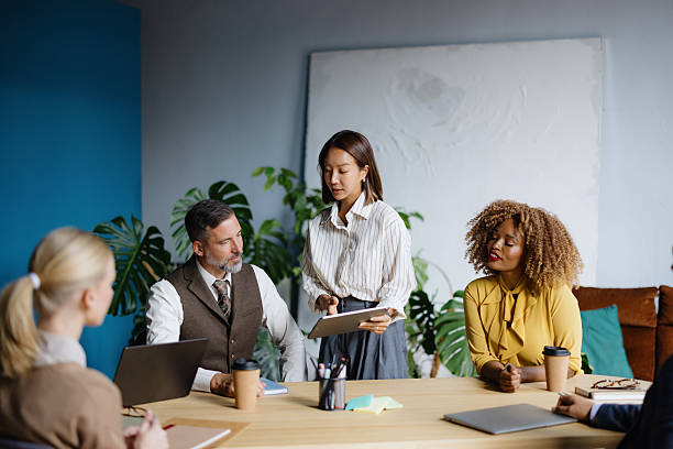 istock Diverse business people having a meeting and discussing ideas 2242083772