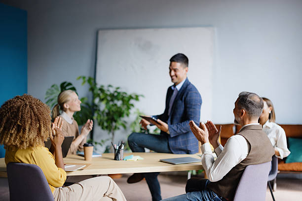 istock Business colleagues congratulating speaker during office meeting 2242083780