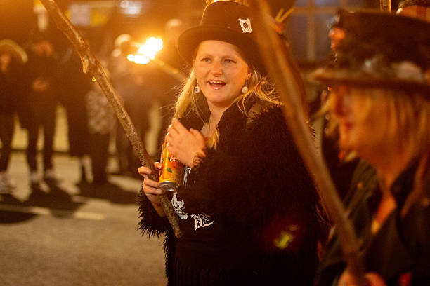 Traditional lighting of bonfires by local residents as the night procession of the Virgin of Los Pegotes passes by. It travels through the streets of Nava del Rey in a horse-drawn carriage. The Virgin is carried up and down from the hermitage to the town church. Nava del Rey, Valladolid, Castile and León, Spain, Europe - November 30, 2024.