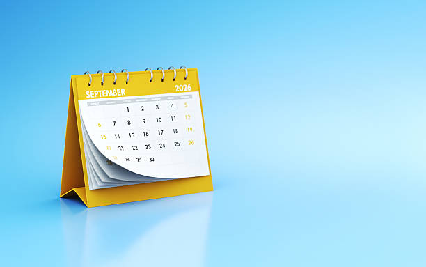 istock September 2026 Yellow Realistic Desk Calendar on Blue Endless Background 2242086848