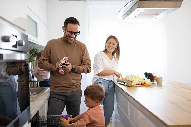 istock Father and Son Together in a Cozy Kitchen Environment 2242090297