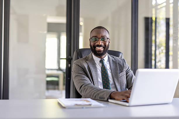 istock Professional man working at modern office desk with laptop 2242090342