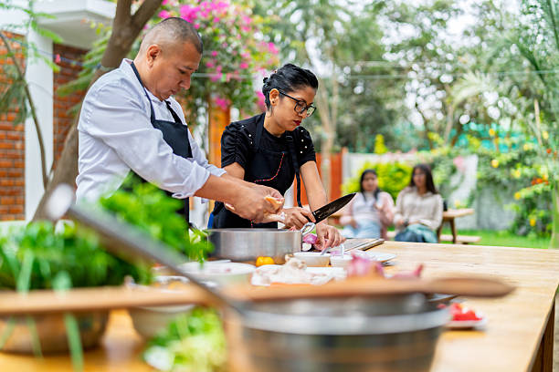 istock Chefs preparing fresh ingredients for outdoor cooking class 2242091876