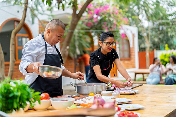 istock Chefs cooking fresh food outdoors for country restaurant 2242091877