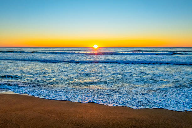 istock Sunrise at the seaside with a cloudless sky 2242095421