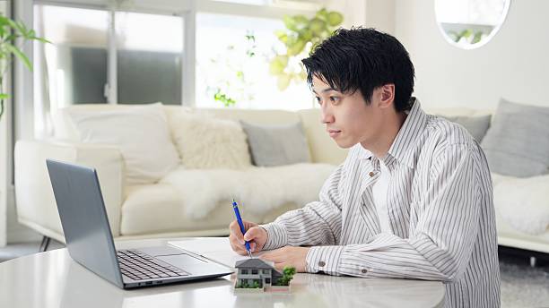 istock Asian man studying real estate 2242096428