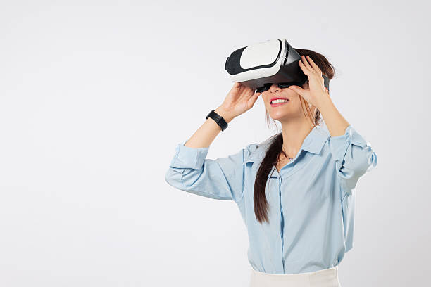 istock Asian young woman using vr virtual reality headset for a game and future tech 2242098938