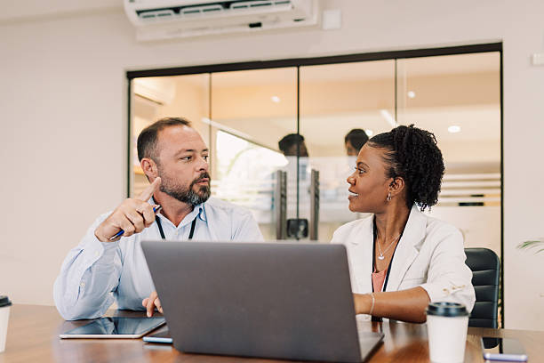 istock Business colleagues having focused conversation in meeting room 2242100812