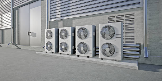 istock Air conditioner system parts installed outside warehouse. Technology for climate control inside large buildings. Industrial HVAC infrastructure for temperature regulation and ventilation. 2242103492