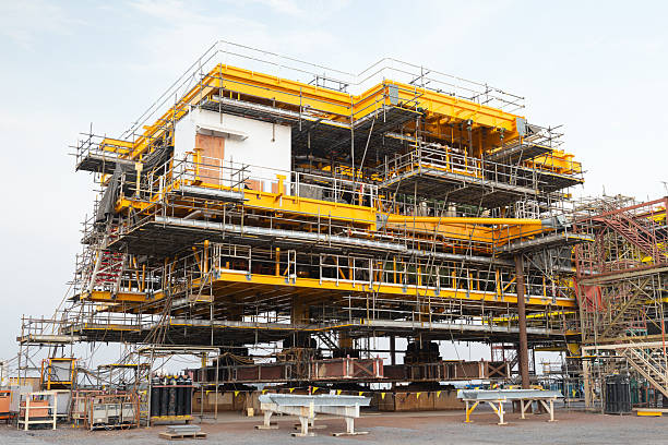 istock Oil rig platform in construction site. Steel structure combined with mechanical and electrical technology. Represents fuel power energy industry, offshore drilling and global business investment. 2242103542