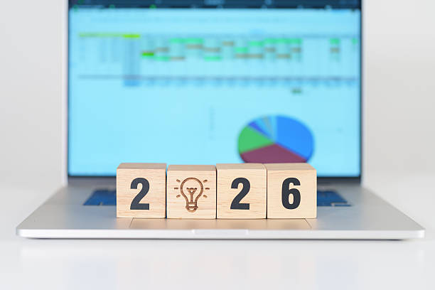 istock 2026 Year block with lightbulb icon against computer laptop background. Business Idea, Creative, Thinking, brainstorm, Goal, Resolution, strategy, plan, Action, change and New Year start concepts 2242105023