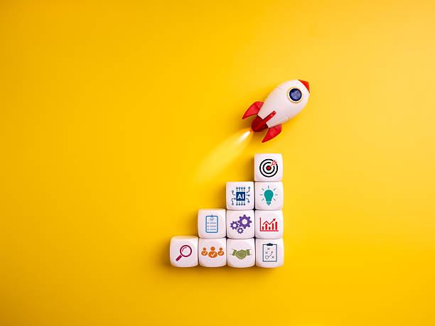istock Business growth and startup concept with rocket launching above stacked dice with strategy icons. Represents planning, innovation, teamwork, goals, marketing, and successful startup development. 2242108852
