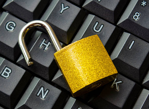 istock Top view of padlock on keyboard background symbolizing restricted entry, secure login or digital safety system. 2242111898