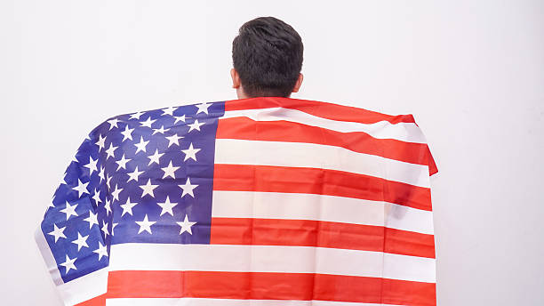 istock Asian Fat Man holding USA flag at studio against white background. 2242112387