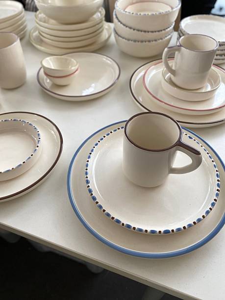 istock Ceramic tableware with minimalist design on display, featuring plates, bowls, and mugs 2242114320