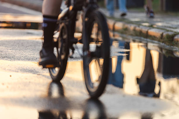 Unrecognizable person is riding bike at public park at sunset.Istanbul - Turkey.