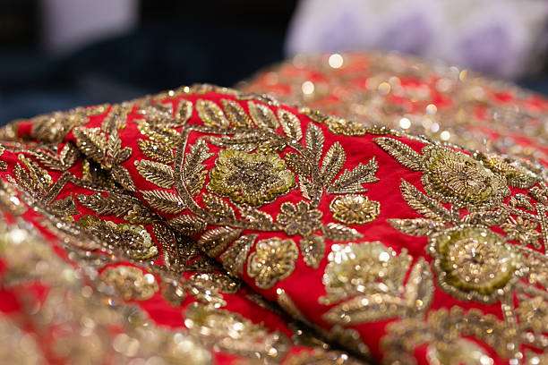 istock Indian bride’s traditional wedding outfit textile fabric and pattern close up 2242117780