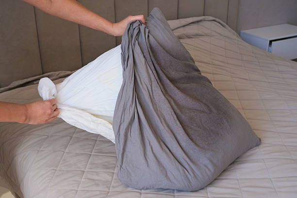 istock The gray pillowcase on the pillow is stained with greasy hair. 2242121008