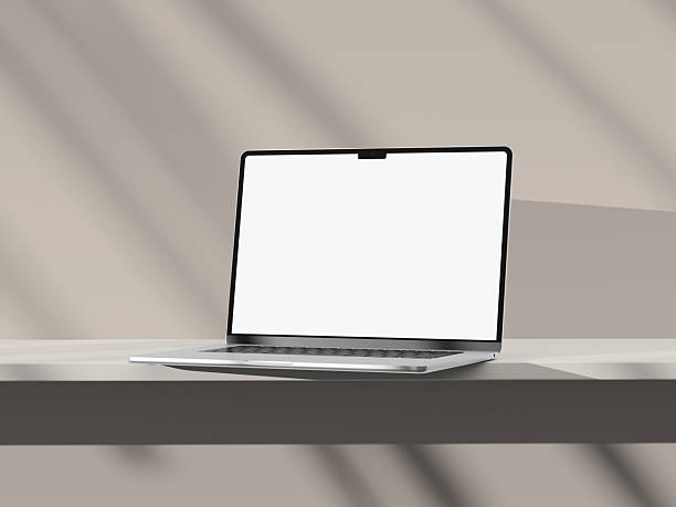 istock Simple and clean laptop mockup with white screen, casting delicate shadows. 2242122816