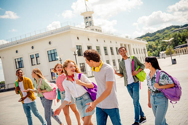 istock Fellows enjoying a sunny day outdoors in the city while walking and laughing together 2242125152