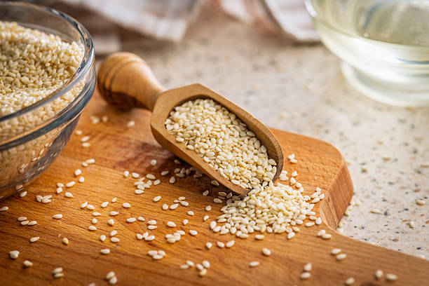 istock Roasted sesame seeds in scoop on cutting board. 2242125520