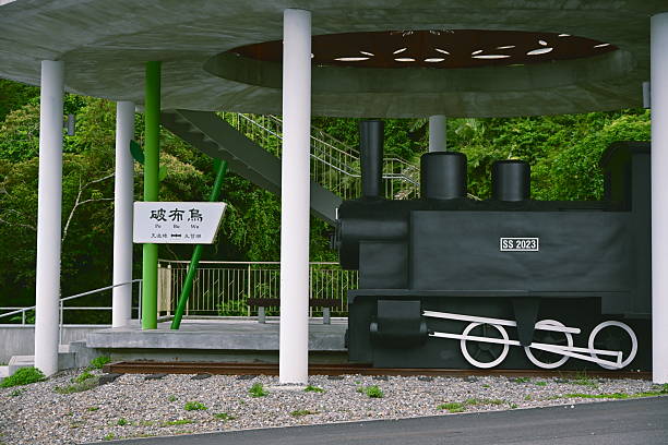 Yilan,  Taiwan - Sep. 27, 2025: Pobuwo viewpoint in Sanxing with 762mm narrow-gauge locomotive replica overlooking Lanyang River, commemorating historic Taipingshan Forest Railway, Yilan County.