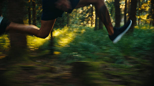 istock Man Running Fast on Forest Trail with Motion Blur 2242128340